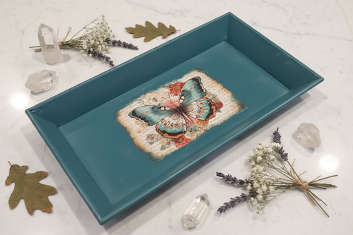 Styled product photo of hand-painted teal butterfly metal tray